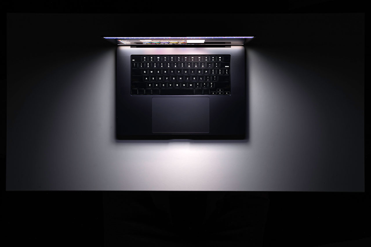 Overhead laptop workspace for web design and digital strategy planning